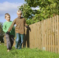 White picket & garden by Armitage Fence in Hancock County IN